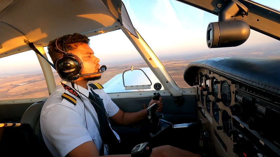 Adam at the controls during commercial flight training